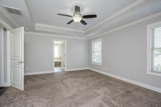 3880 Leighton Ln, Lexington, KY 40515 - spare room featuring a tray ceiling, carpet floors, plenty of natural light, and crown molding