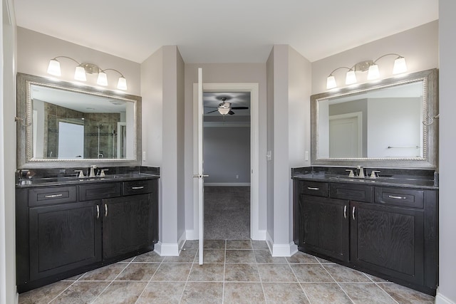 3880 Leighton Ln, Lexington, KY 40515 - full bath with a shower stall, a ceiling fan, two vanities, and baseboards