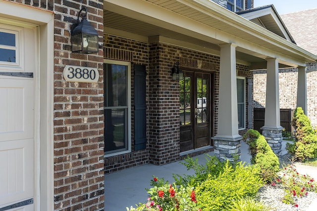 3880 Leighton Ln, Lexington, KY 40515 - doorway to property featuring brick siding, covered porch, and french doors