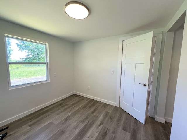 819 Scotts Chapel Rd, Jamestown, KY 42629 - unfurnished bedroom featuring dark wood finished floors and baseboards