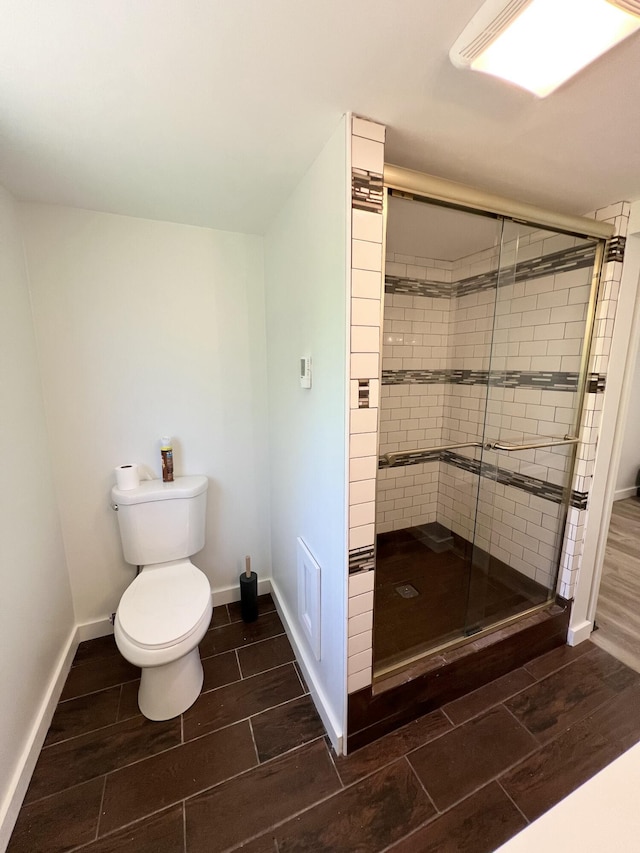 819 Scotts Chapel Rd, Jamestown, KY 42629 - bathroom featuring a shower stall, toilet, baseboards, and wood finish floors