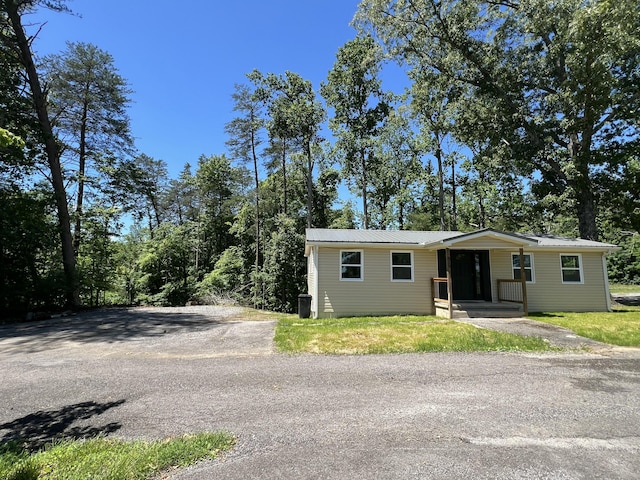 819 Scotts Chapel Rd, Jamestown, KY 42629 - view of front facade featuring metal roof, a porch, and asphalt driveway