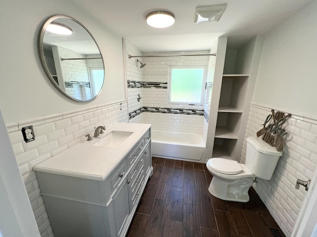819 Scotts Chapel Rd, Jamestown, KY 42629 - bathroom featuring tile walls, toilet, vanity,  shower combination, and wood finished floors