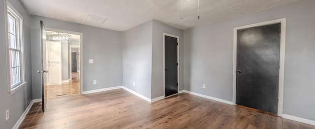 108 Rancho Ct, Frankfort, KY 40601 - unfurnished bedroom featuring wood finished floors and baseboards