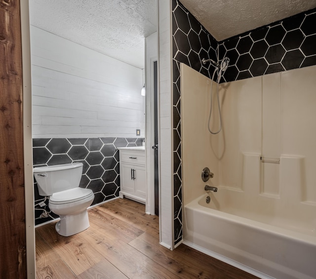 108 Rancho Ct, Frankfort, KY 40601 - bathroom featuring toilet, a textured ceiling, shower / bath combination, wood finished floors, and vanity