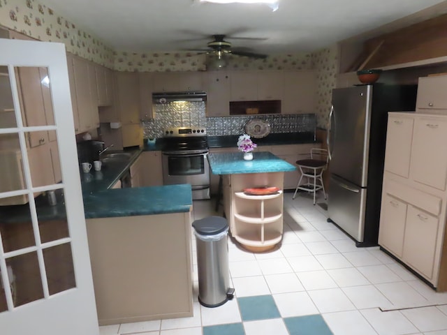 3200 US-60 W, Morehead, KY 40351 - kitchen featuring appliances with stainless steel finishes, ceiling fan, under cabinet range hood, dark countertops, and a sink