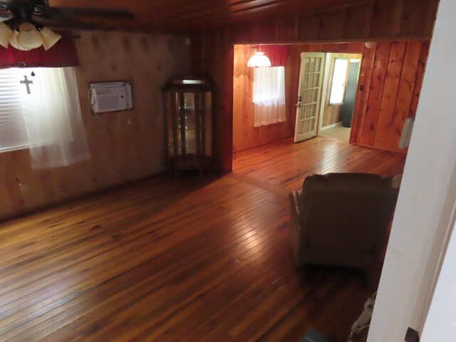3200 US-60 W, Morehead, KY 40351 - living area featuring wood-type flooring, wooden walls, a ceiling fan, and an AC wall unit