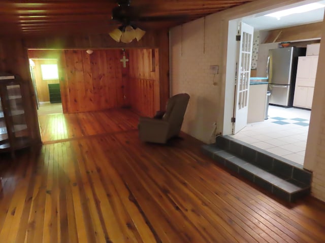 3200 US-60 W, Morehead, KY 40351 - unfurnished room featuring hardwood / wood-style flooring, wood walls, and a ceiling fan