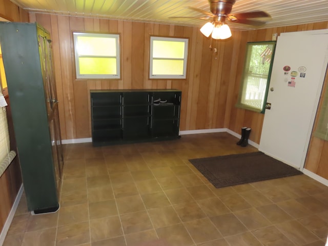 3200 US-60 W, Morehead, KY 40351 - foyer with healthy amount of natural light, baseboards, a ceiling fan, wood walls, and wooden ceiling