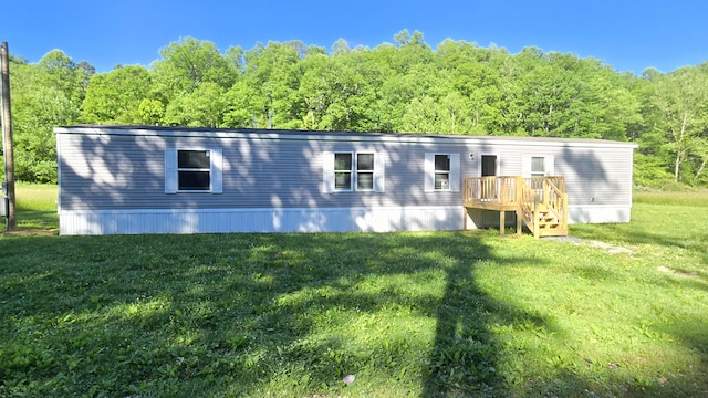 2499 Sacker Rd, Manchester, KY 40962 - rear view of house featuring a lawn and a view of trees