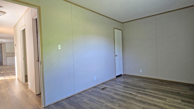2499 Sacker Rd, Manchester, KY 40962 - unfurnished bedroom featuring dark wood-style floors and crown molding