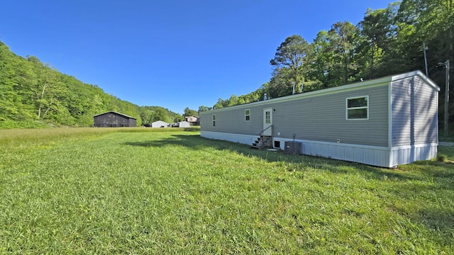 2499 Sacker Rd, Manchester, KY 40962 - rear view of property with a yard, entry steps, and central AC unit