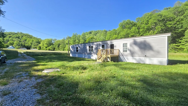 2499 Sacker Rd, Manchester, KY 40962 - back of property with a view of trees and a lawn