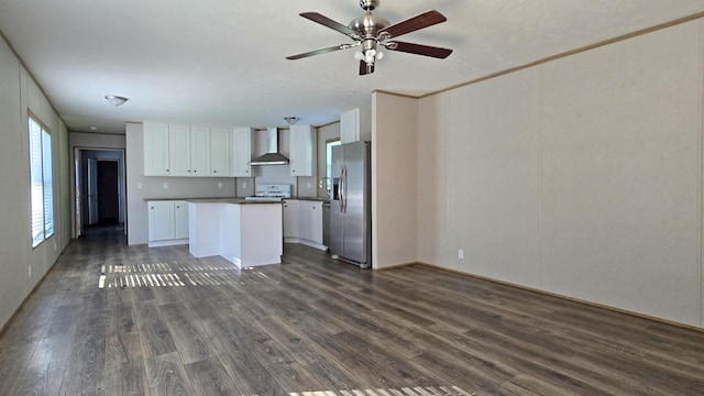 2499 Sacker Rd, Manchester, KY 40962 - kitchen featuring stainless steel fridge, wall chimney exhaust hood, white range with gas cooktop, a kitchen island, and white cabinets