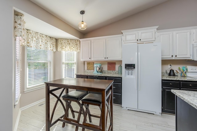 4140 Clearwater Way, Lexington, KY 40515 - kitchen with white appliances, white cabinets, vaulted ceiling, light stone counters, and hanging light fixtures