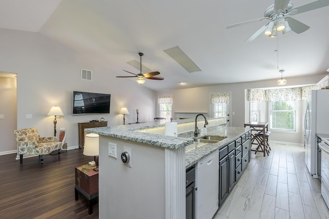 4140 Clearwater Way, Lexington, KY 40515 - kitchen featuring ceiling fan, lofted ceiling, a sink, healthy amount of natural light, and baseboards