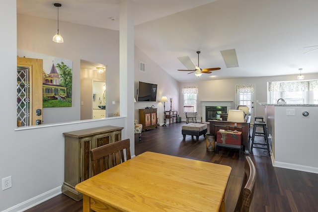 4140 Clearwater Way, Lexington, KY 40515 - dining room with ceiling fan, baseboards, wood finished floors, a glass covered fireplace, and high vaulted ceiling