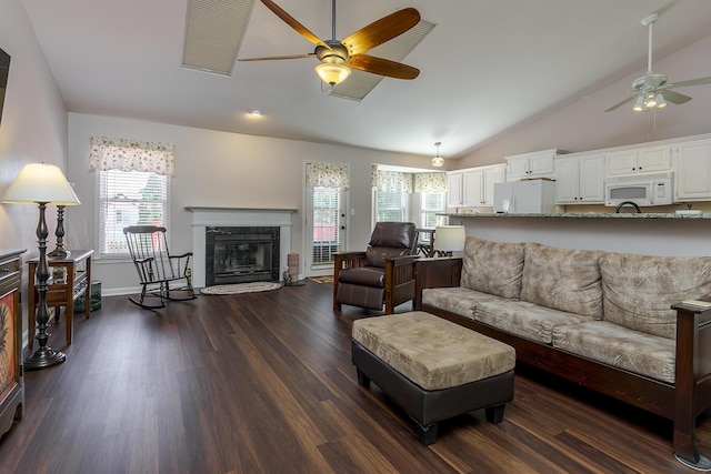 4140 Clearwater Way, Lexington, KY 40515 - living area featuring ceiling fan, dark wood finished floors, lofted ceiling, a fireplace, and baseboards