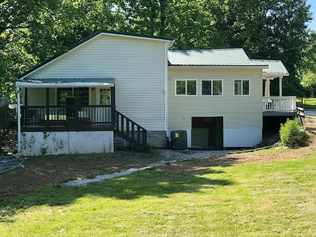 624 Richardson Ln, Frankfort, KY 40601 - back of house with a lawn, covered porch, central AC, and metal roof