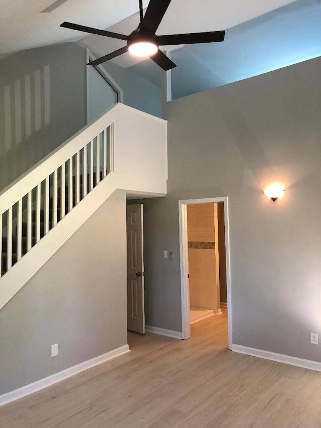 624 Richardson Ln, Frankfort, KY 40601 - empty room featuring ceiling fan, wood finished floors, baseboards, and high vaulted ceiling