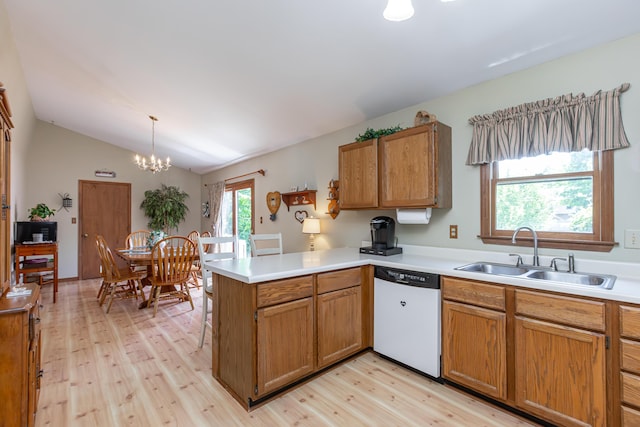 428 Patchen Dr, Lexington, KY 40517 - kitchen featuring dishwashing machine, a sink, a peninsula, light wood-style flooring, and light countertops