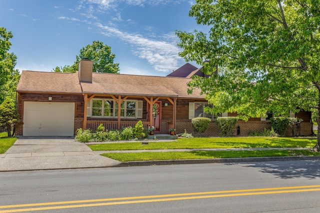 428 Patchen Dr, Lexington, KY 40517 - single story home with an attached garage, a chimney, concrete driveway, a front lawn, and brick siding