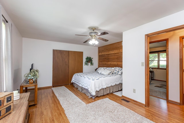 428 Patchen Dr, Lexington, KY 40517 - bedroom with light wood-style flooring, a closet, baseboards, and a ceiling fan
