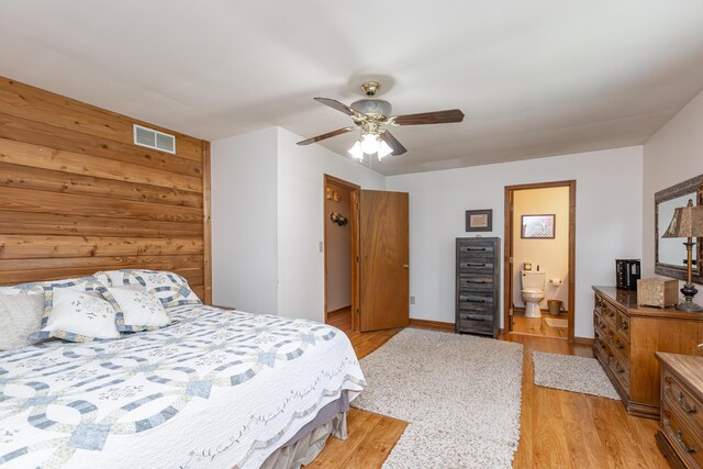 428 Patchen Dr, Lexington, KY 40517 - bedroom with light wood finished floors, ceiling fan, ensuite bath, and baseboards