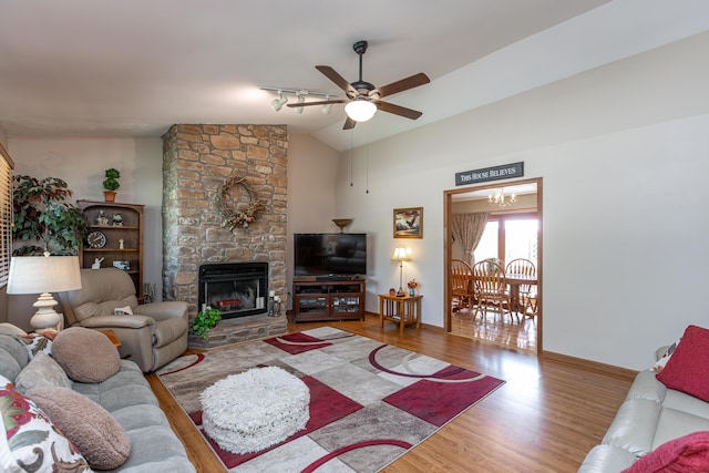 428 Patchen Dr, Lexington, KY 40517 - living room with lofted ceiling, wood finished floors, ceiling fan, baseboards, and a fireplace