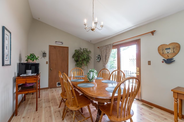 428 Patchen Dr, Lexington, KY 40517 - dining space with a chandelier, light wood finished floors, lofted ceiling, and baseboards