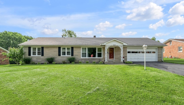 900 Shoshoni Trl, Georgetown, KY 40324 - ranch-style home featuring asphalt driveway, an attached garage, a front lawn, and stone siding