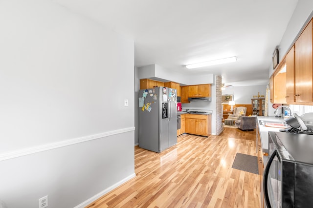 900 Shoshoni Trl, Georgetown, KY 40324 - kitchen with stainless steel refrigerator with ice dispenser, light wood-style flooring, a sink, and under cabinet range hood