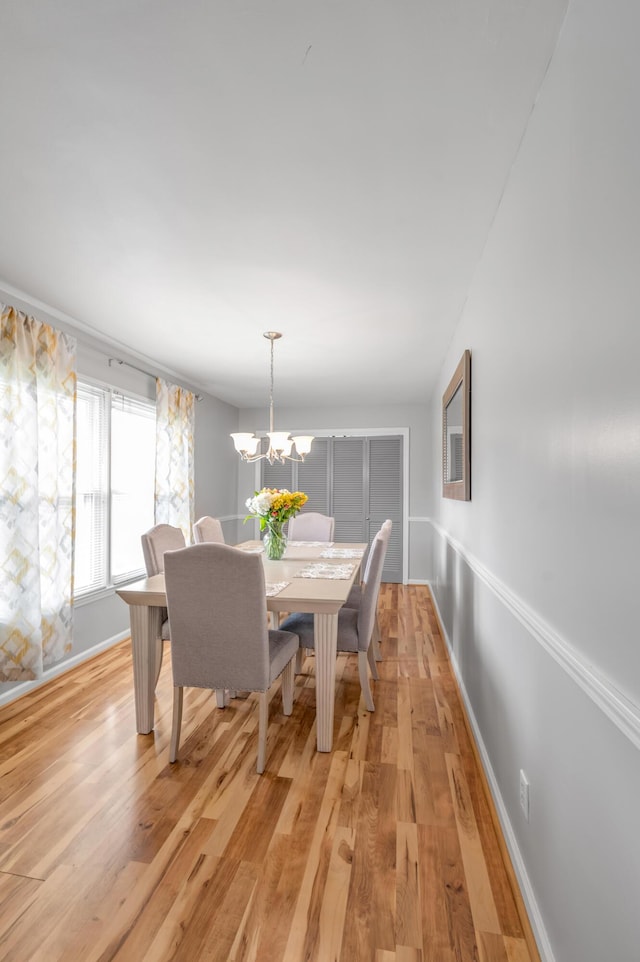 900 Shoshoni Trl, Georgetown, KY 40324 - dining area featuring light wood-style flooring, baseboards, and a chandelier