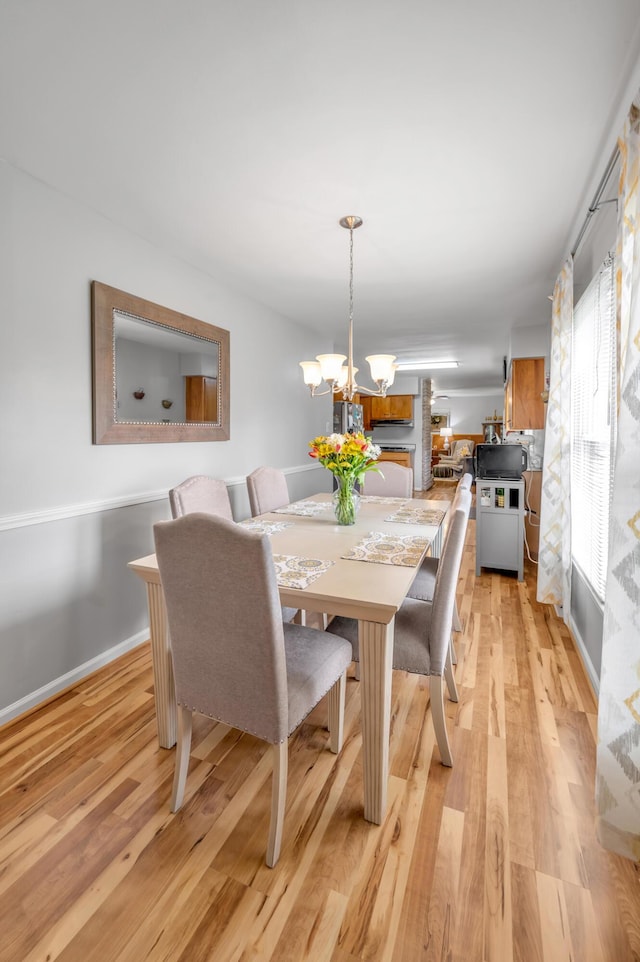 900 Shoshoni Trl, Georgetown, KY 40324 - dining space featuring a chandelier and light wood-style flooring