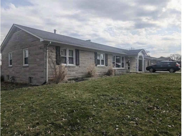 900 Shoshoni Trl, Georgetown, KY 40324 - view of front of home with stone siding and a front yard