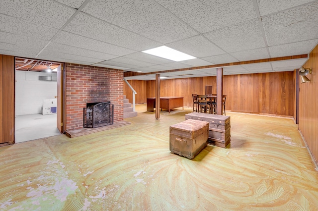 900 Shoshoni Trl, Georgetown, KY 40324 - living area with a fireplace, wood walls, and a drop ceiling