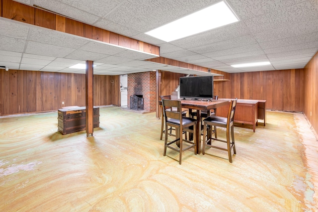 900 Shoshoni Trl, Georgetown, KY 40324 - dining room featuring a drop ceiling, wood walls, and a fireplace