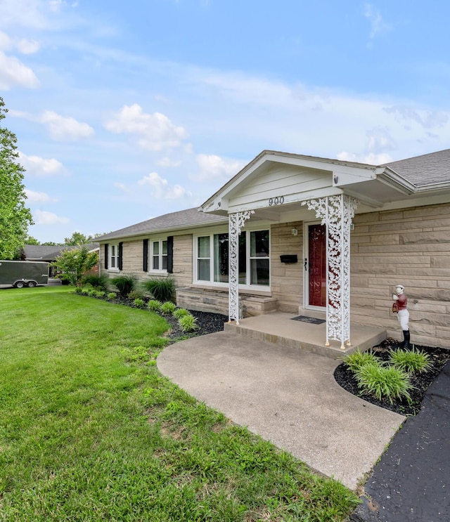 900 Shoshoni Trl, Georgetown, KY 40324 - ranch-style house with a front yard, covered porch, and stone siding