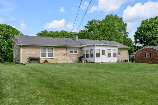 900 Shoshoni Trl, Georgetown, KY 40324 - rear view of property with a chimney, a lawn, cooling unit, and stone siding
