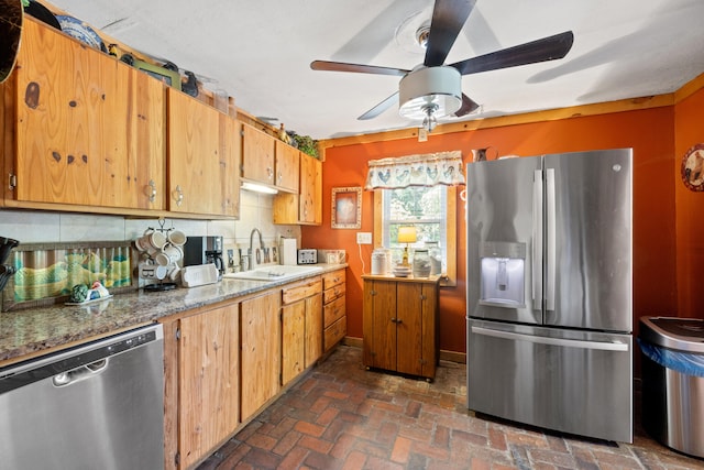 4496 Fords Mill Rd, Versailles, KY 40383 - kitchen with stainless steel appliances, a sink, a ceiling fan, brown cabinetry, and brick flooring