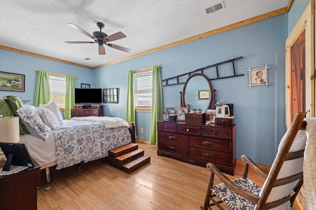 4496 Fords Mill Rd, Versailles, KY 40383 - bedroom with light wood-style floors, a textured ceiling, and a ceiling fan
