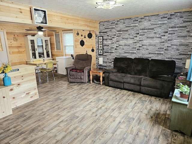 270 Newcomb Ave, Mount Vernon, KY 40456 - living area featuring wood finished floors, a textured ceiling, wood walls, a ceiling fan, and electric panel