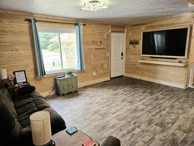 270 Newcomb Ave, Mount Vernon, KY 40456 - living room featuring wooden walls, a textured ceiling, and dark wood-style flooring