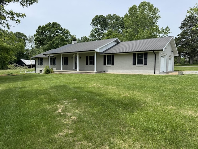 83 Gene Conner Rd, Russell Springs, KY 42642 - view of front of house with a garage, a front lawn, a chimney, and metal roof