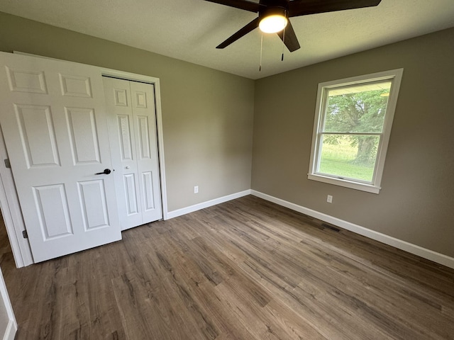 83 Gene Conner Rd, Russell Springs, KY 42642 - unfurnished bedroom featuring baseboards, dark wood finished floors, a closet, and ceiling fan