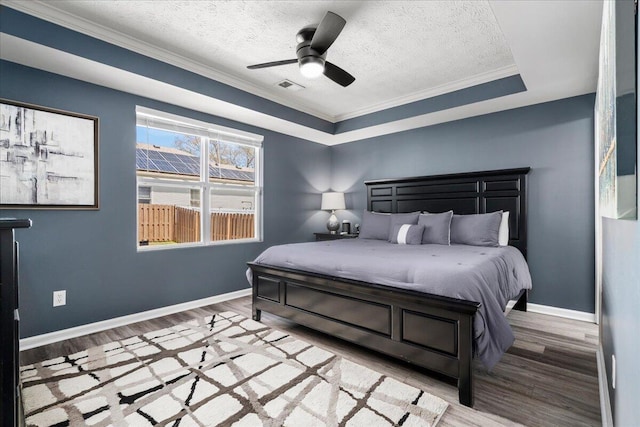 253 Gateway Park Cir, Lexington, KY 40511 - bedroom featuring wood finished floors, a textured ceiling, crown molding, baseboards, and a ceiling fan