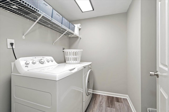 253 Gateway Park Cir, Lexington, KY 40511 - laundry room featuring washer and clothes dryer, wood finished floors, and baseboards
