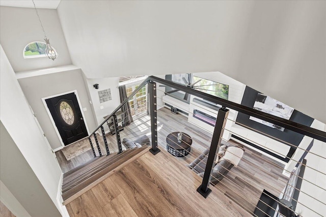 253 Gateway Park Cir, Lexington, KY 40511 - stairway featuring a high ceiling, a chandelier, and wood finished floors