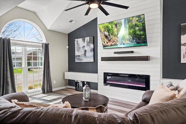 253 Gateway Park Cir, Lexington, KY 40511 - living room featuring a fireplace, a ceiling fan, vaulted ceiling, wood finished floors, and baseboards
