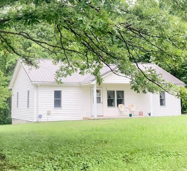 1184 Snow Creek Rd, Clay City, KY 40312 - back of property with metal roof and a lawn